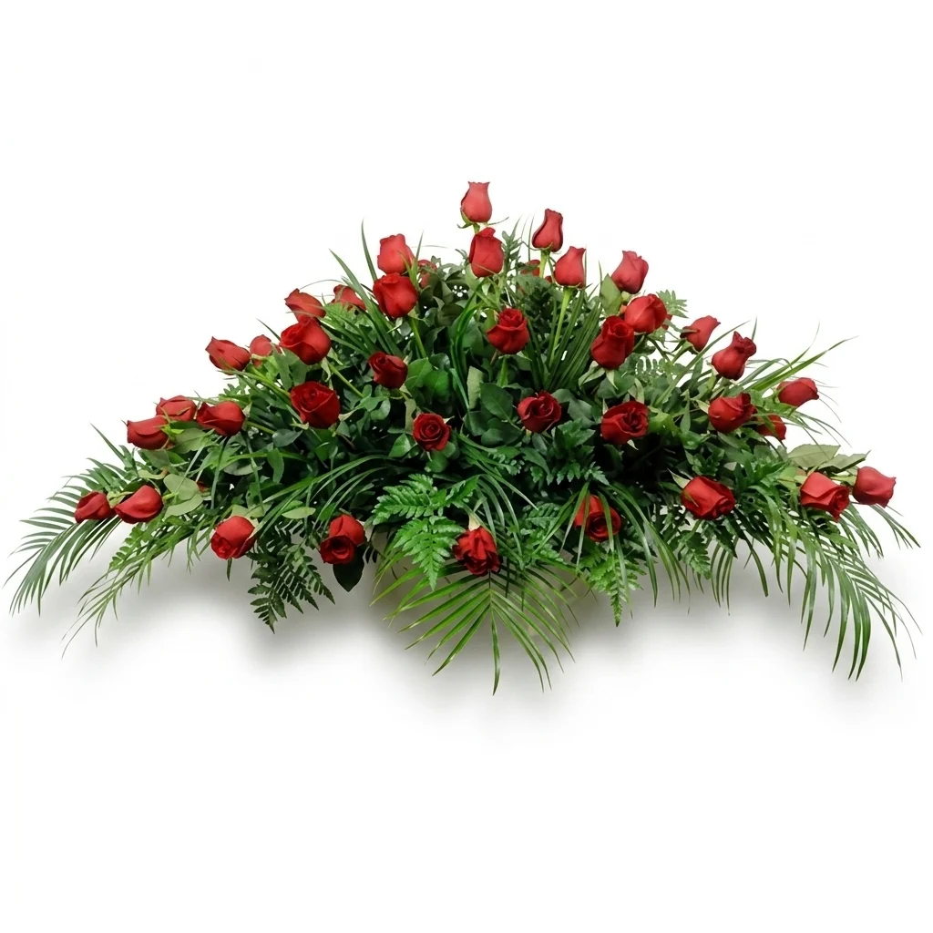 Red rose funeral spray on a white background