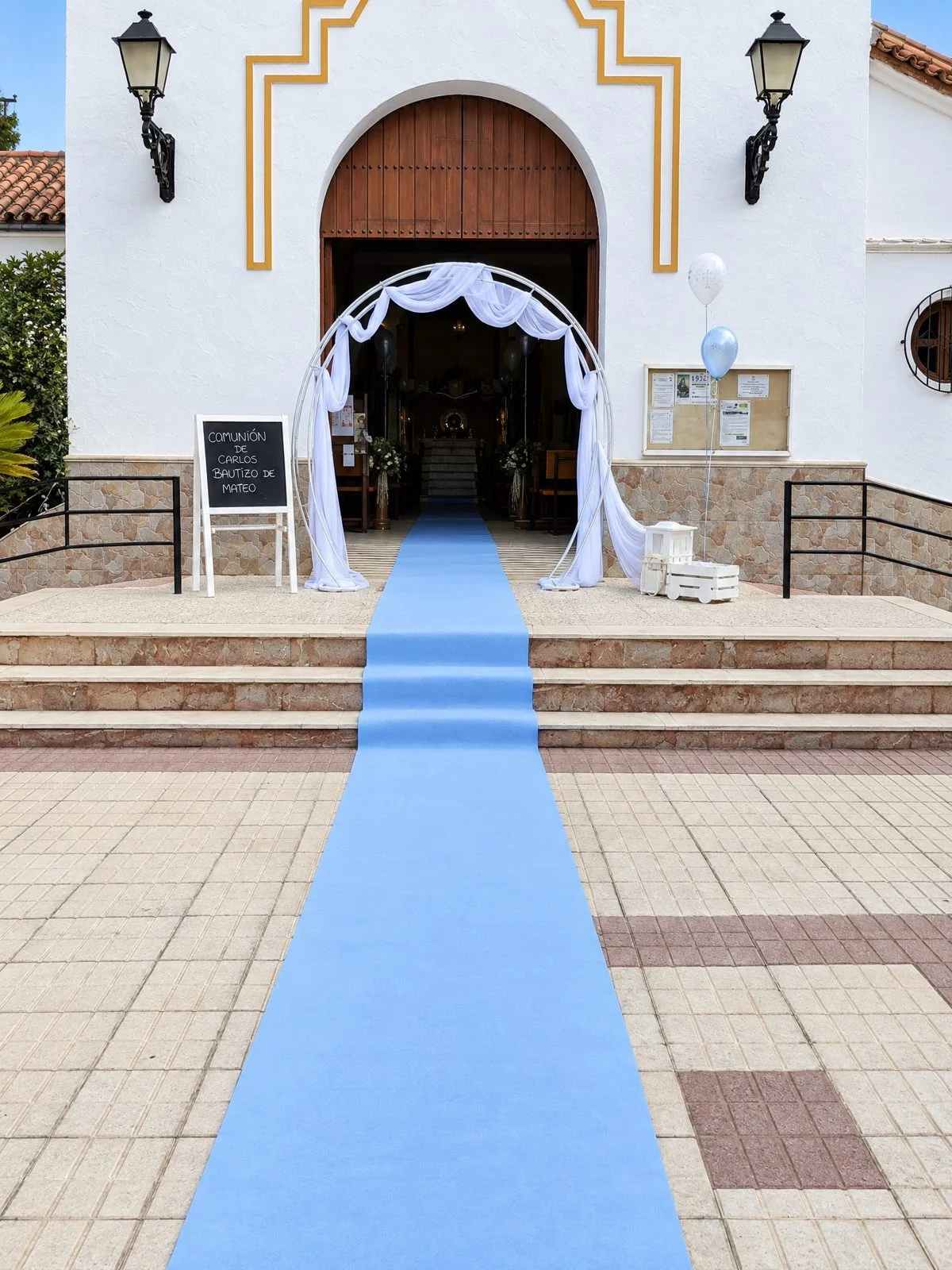 Blue aisle runner at the entrance to a church