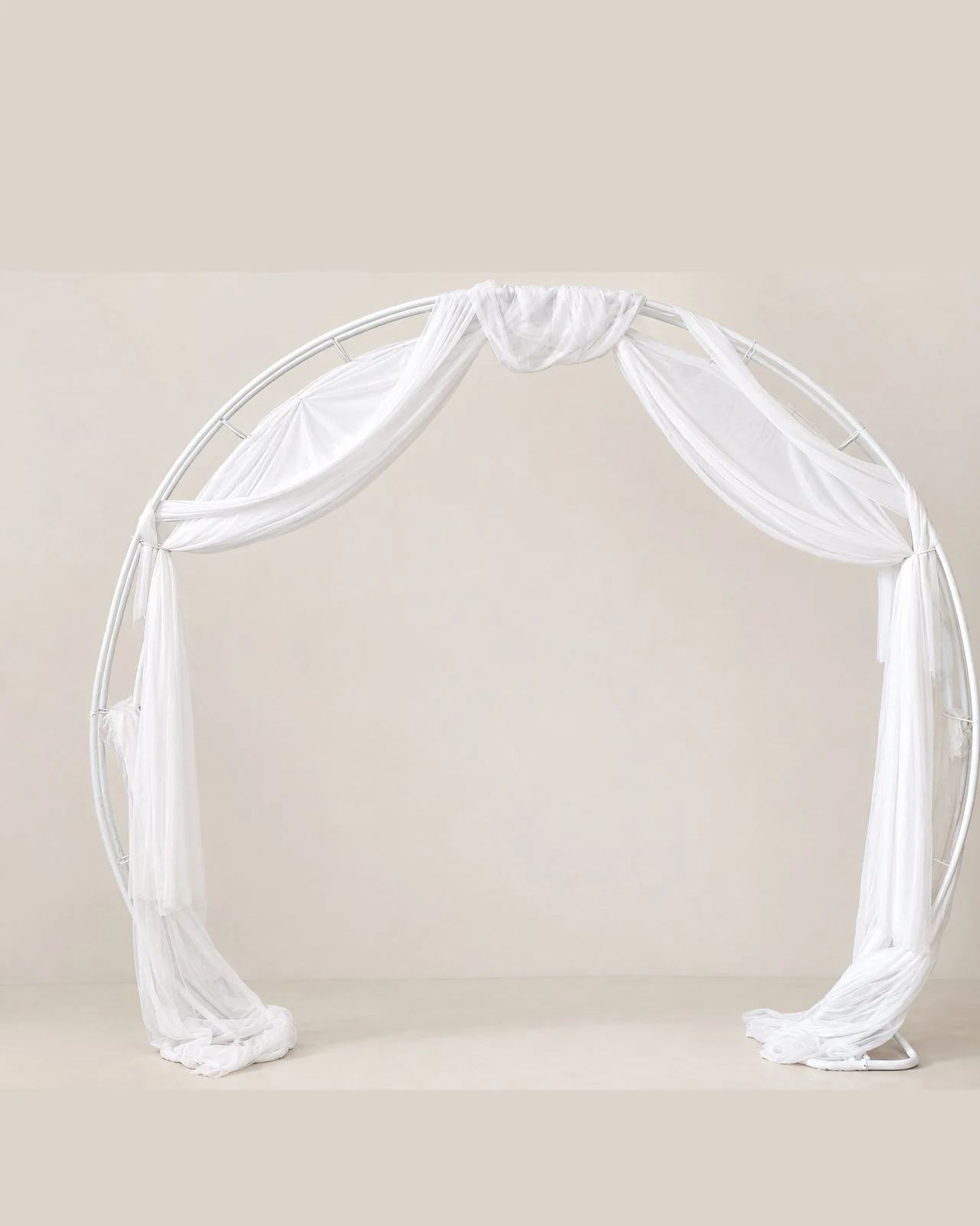 Wrought-iron arch with white tulle