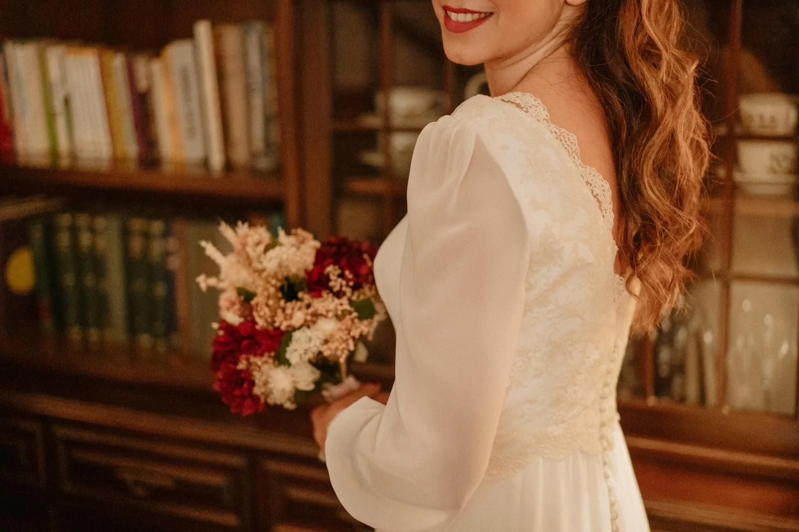 Bride with a bouquet of roses and gypsophila