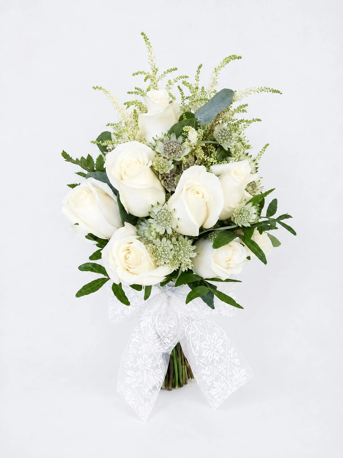 Bridal bouquet of white roses and greenery