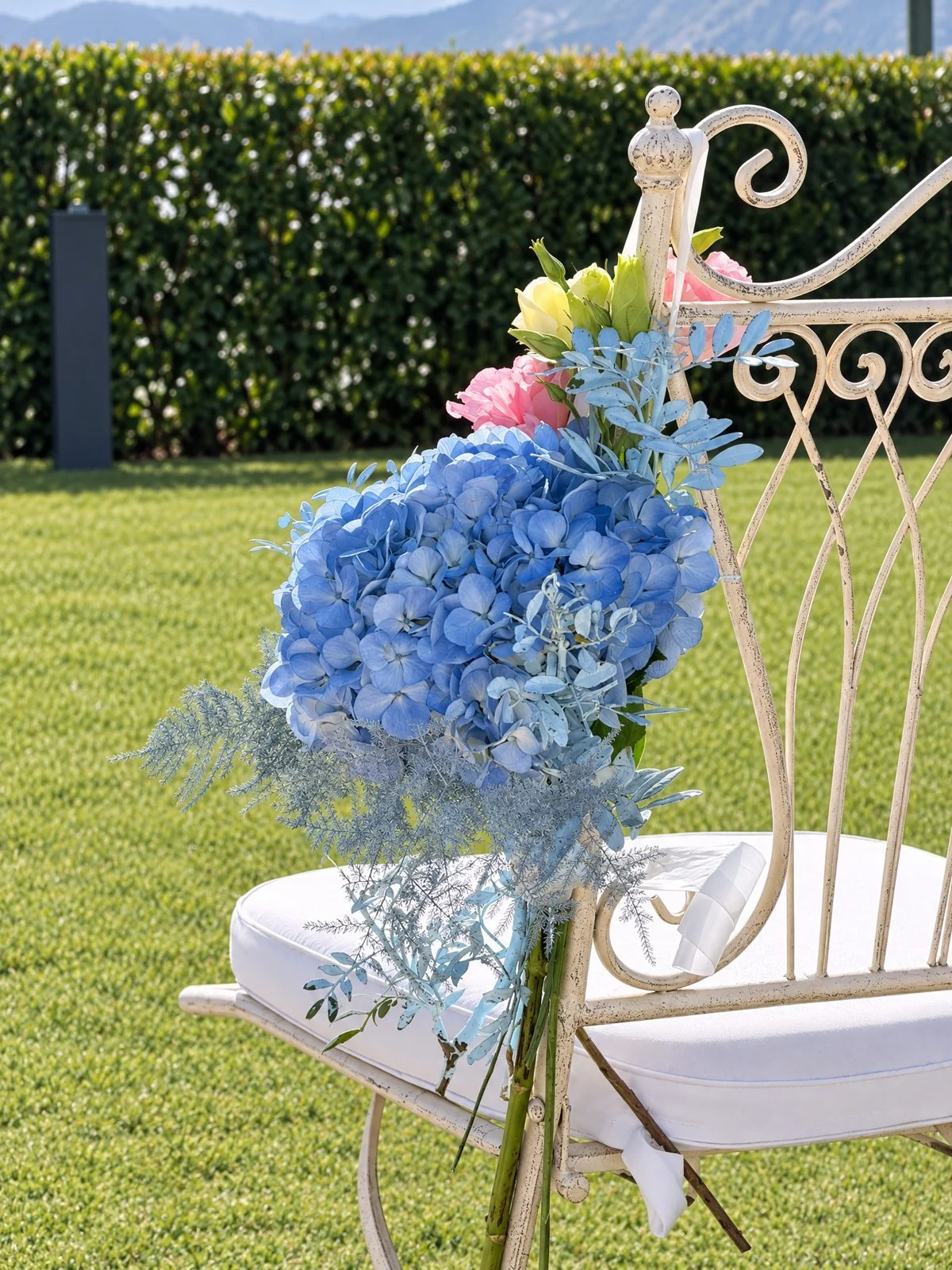 Ceremony chair with a posy of blue hydrangea
